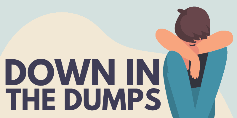 Down in the Dumps - Idiom, Origin & Meaning